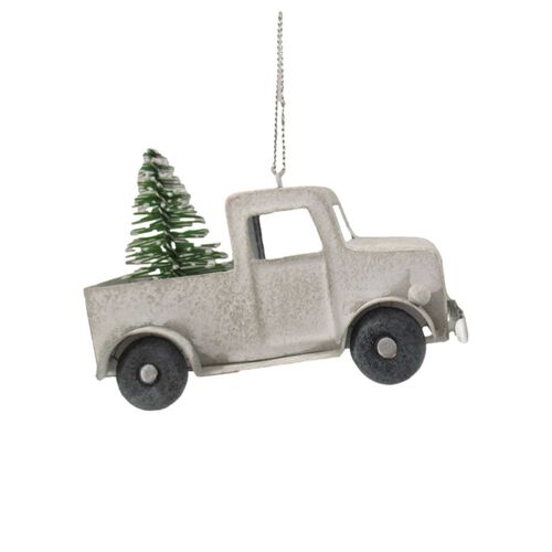 White Car With Tree On Roof