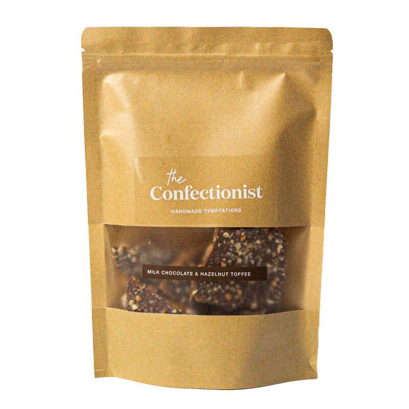 The Confectionist Handmade Hazelnut Toffee With Milk Chocolate Pouch 200g image number 0