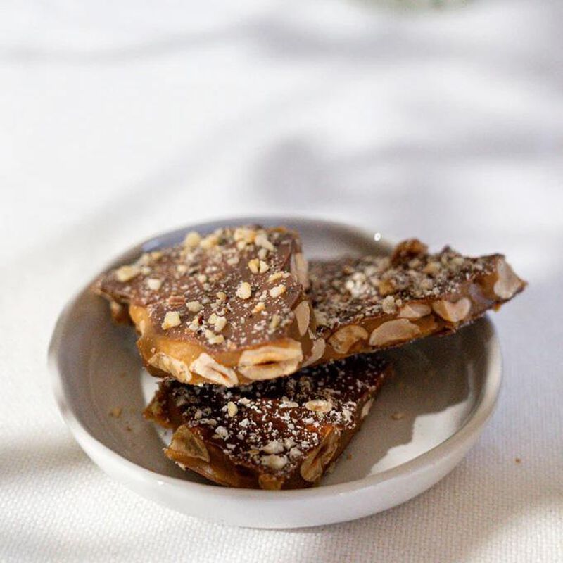 The Confectionist Handmade Hazelnut Toffee With Milk Chocolate Pouch 200g image number 1