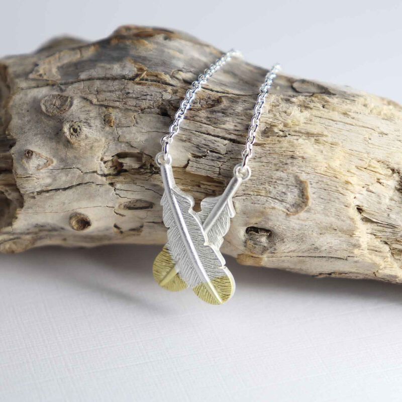 Little Taonga Huia Crossed Feather Necklace Silver With Gold Tips image number 1